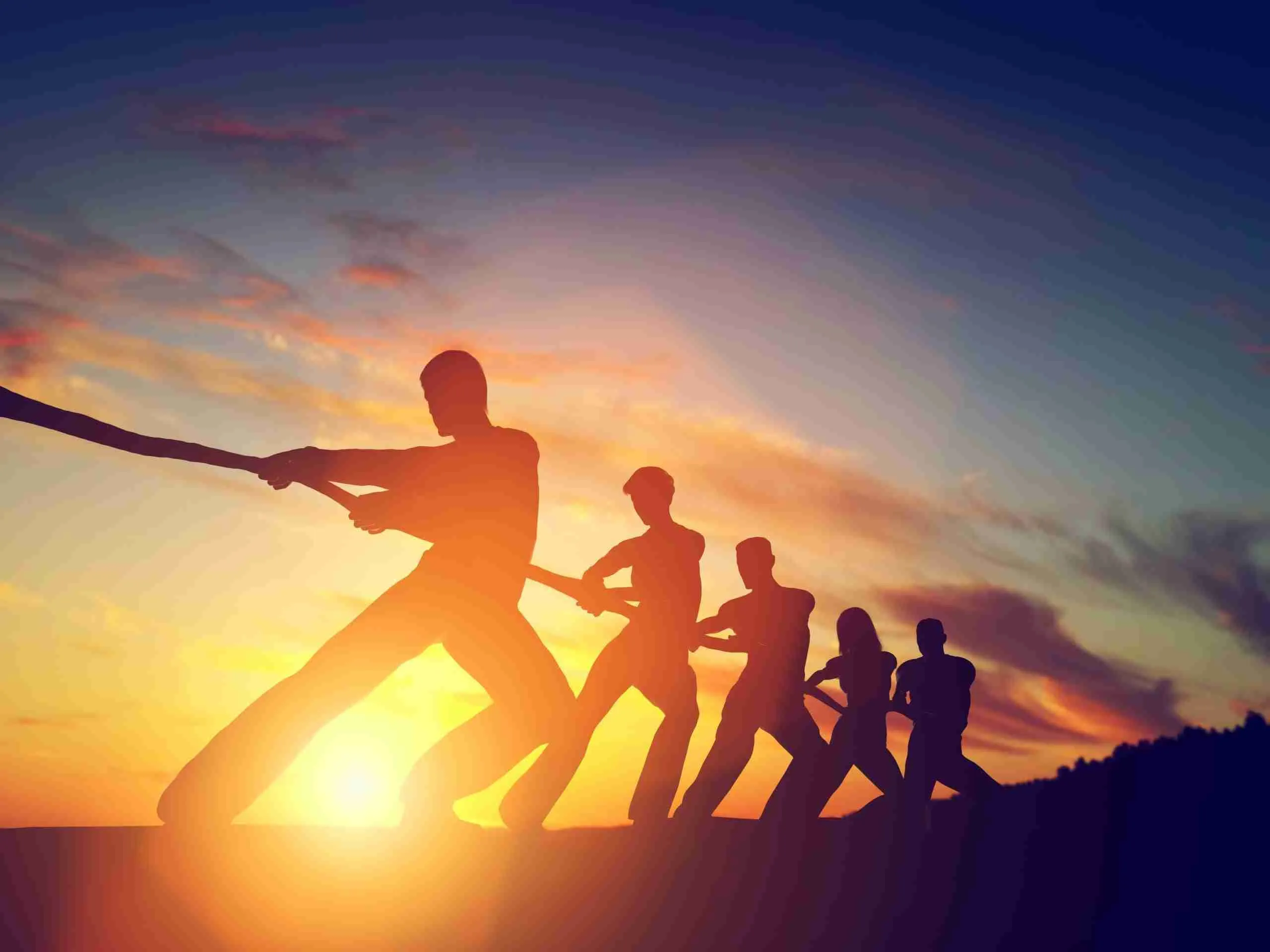 Group,Of,People,,Team,Pulling,Line,,Playing,Tug,Of,War. Erfolgreiches Team dank Mitarbeitercoaching