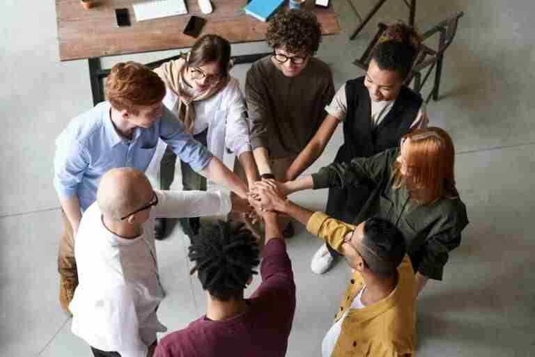 photo of people holding each other s hands