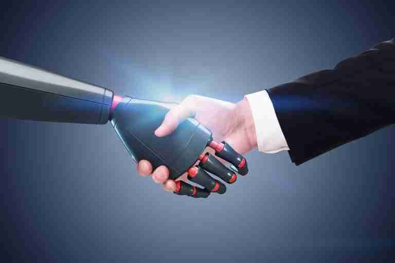 Handshake between a human hand and a robotic prosthetic hand, symbolizing human-robot collaboration